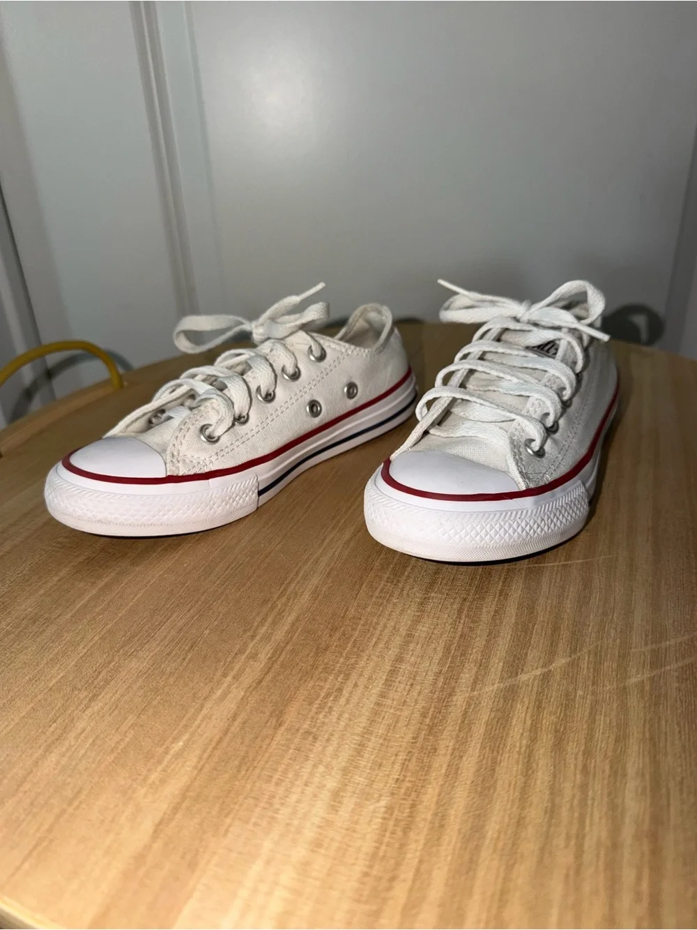 Converse Low Top Canvas Sneakers in White with Red Trim